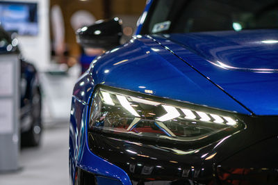 Audi e-tron gt electric supercar premiere at a motor show, full led headlights closeup