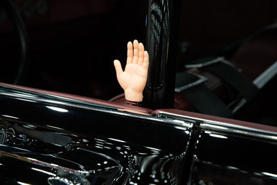 Cropped hand of man playing piano