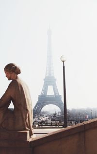 Eiffel tower against clear sky in city