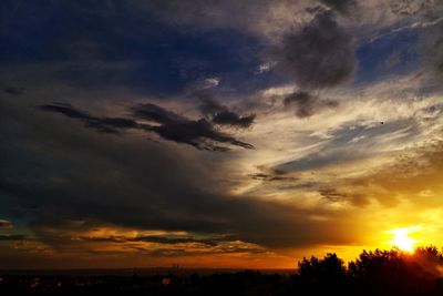 Low angle view of dramatic sky during sunset