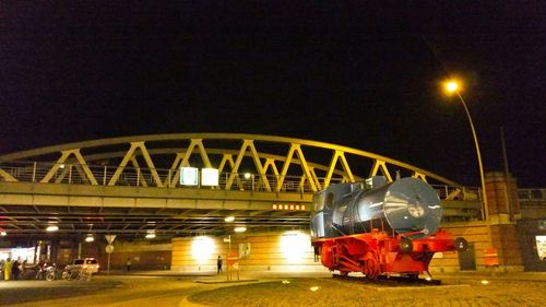 Illuminated ferris wheel at night