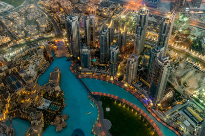 High angle view of illuminated buildings in city
