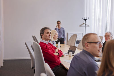 People taking during business meeting