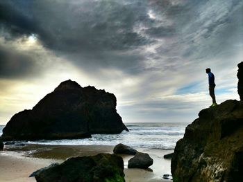 Scenic view of sea against cloudy sky