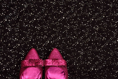 Close-up of christmas lights against black background