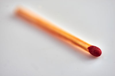High angle view of red pencils on white background