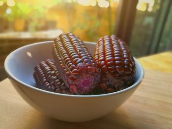 Close-up of sweet purple corn
 in bowl on table