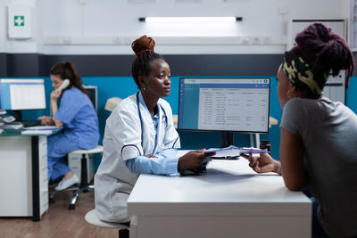 Female doctor working at clinic