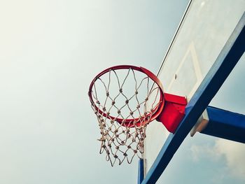 Low angle view of basketball hoop against sky