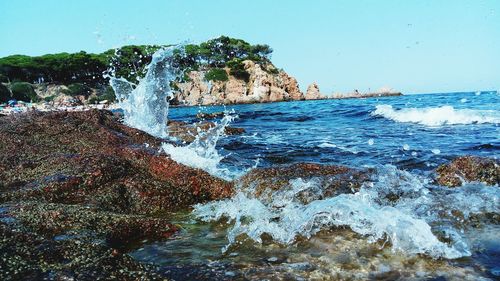 Sea waves splashing on rocks