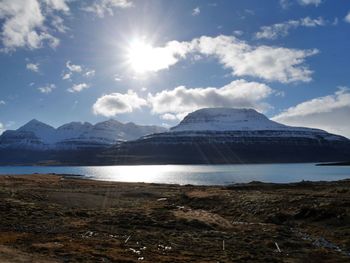 Scenic view of lake and mountains against sky