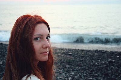 Portrait of beautiful young woman on beach
