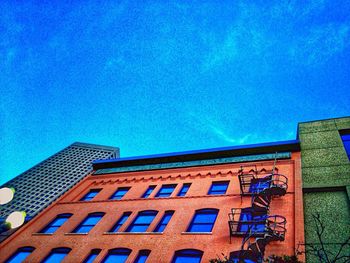 Low angle view of building against blue sky