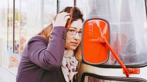Close-up of woman sitting on bench