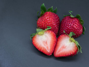 High angle view of strawberries on black background