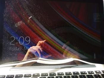 Close-up of hand on glass window