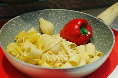 Close-up of chopped fruits in bowl on table