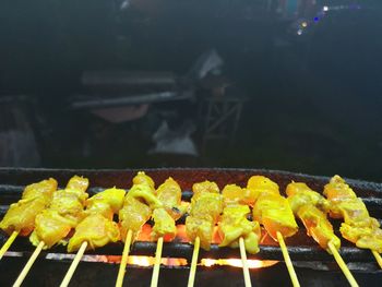 Close-up of yellow meat on barbecue grill