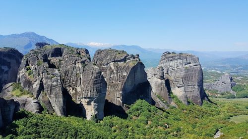 Panoramic shot of rocks on landscape against sky