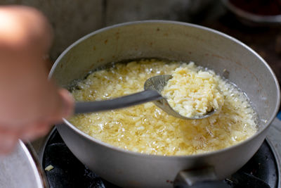 Close-up of person preparing food in bowl