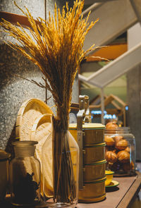 Close-up of yellow vase on table