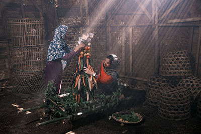 Rear view of man standing by plants