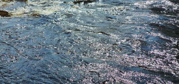 Full frame shot of water flowing through rocks