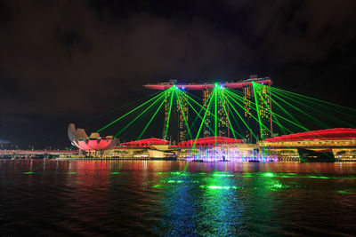 Illuminated ferris wheel at night