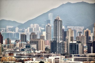 Modern buildings in city against sky