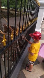 High angle view of girl standing by railing