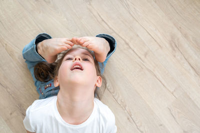 High angle view of girl bending backwards
