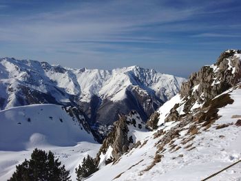 Scenic view of snowcapped mountains against sky