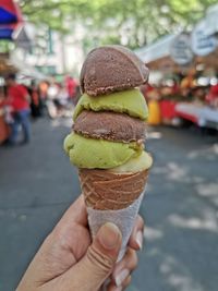 Hand holding ice cream cone