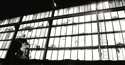 Man seen through glass window