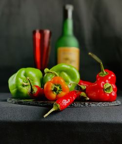 Close-up of red chili peppers on table