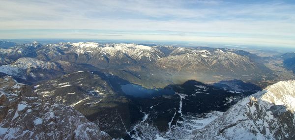 Scenic view of snowcapped mountains against sky