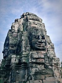 Low angle view of statue against sky