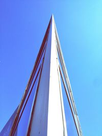 Low angle view of modern building against blue sky