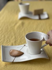 Close-up of coffee cup on table