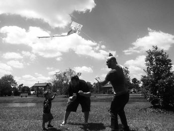 Girl playing with arms outstretched in background