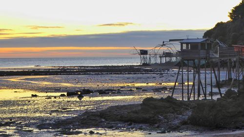 Scenic view of sea against sky at sunset