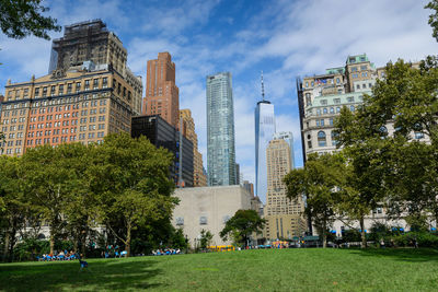 Panoramic shot of trees and buildings against sky