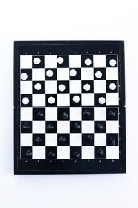 Close-up of chess board against white background