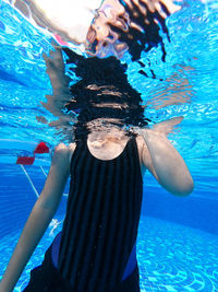 Woman swimming in pool