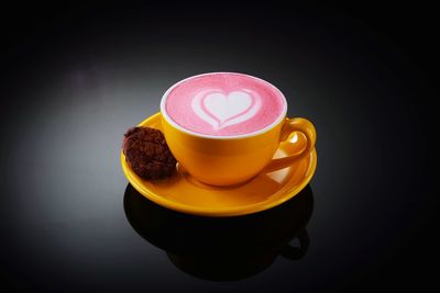 Close-up of coffee served on table