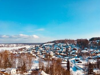 Scenic view of frozen river against sky during winter