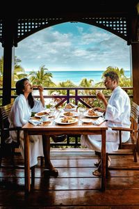 Couple having food at table in restaurant