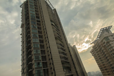 Low angle view of modern buildings against sky