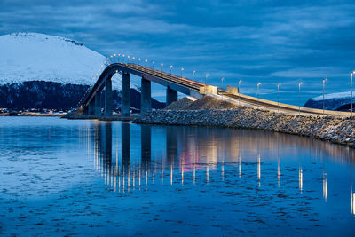 Lepsøyrevet lighthouse with lepsøy bridge in the background, haramsøya, Ålesund, norway.