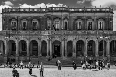 Group of people in front of historical building